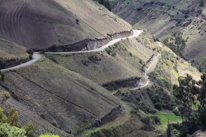 Rural hilly landscape, with roads cut into the hillside