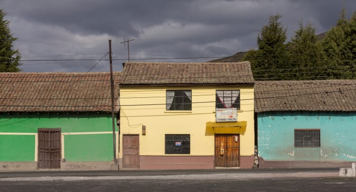 Pastel coloured building facades beside the road