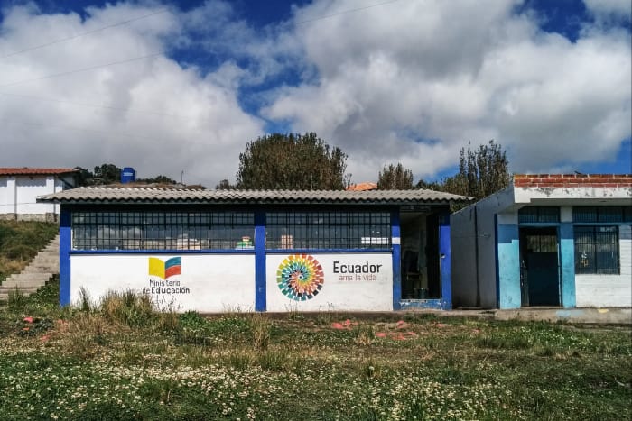 Small one-room school buildings in field