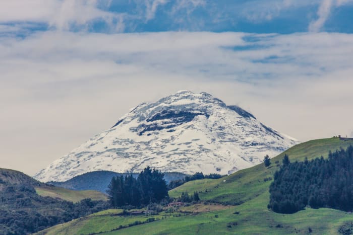Snow-covered peak of Mount Chimborazo, with surrounding landscape