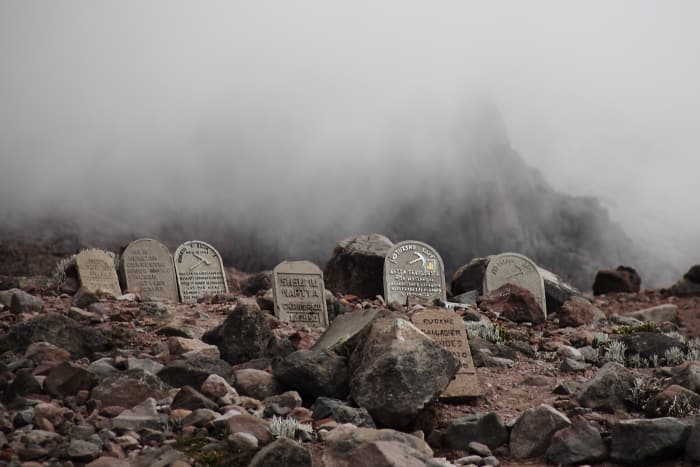 Gravestones among rocks on the mountain hillside