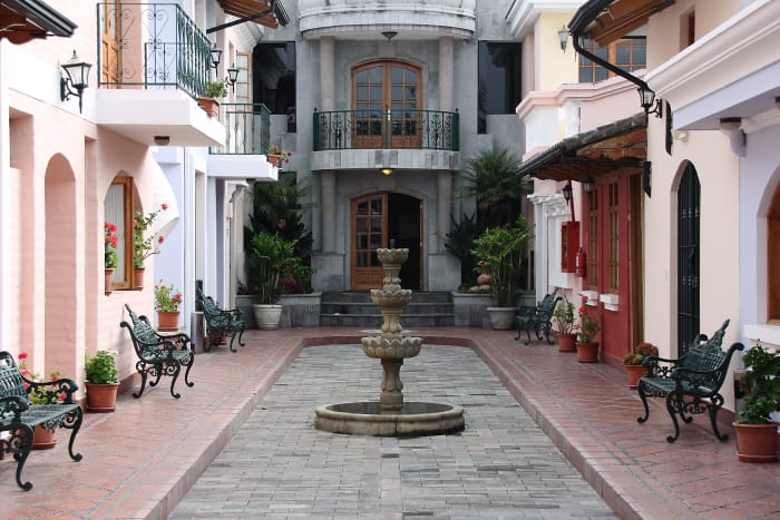 Interior stone courtyard with fountain, in the Rincon de Puembo hotel, Ecuador