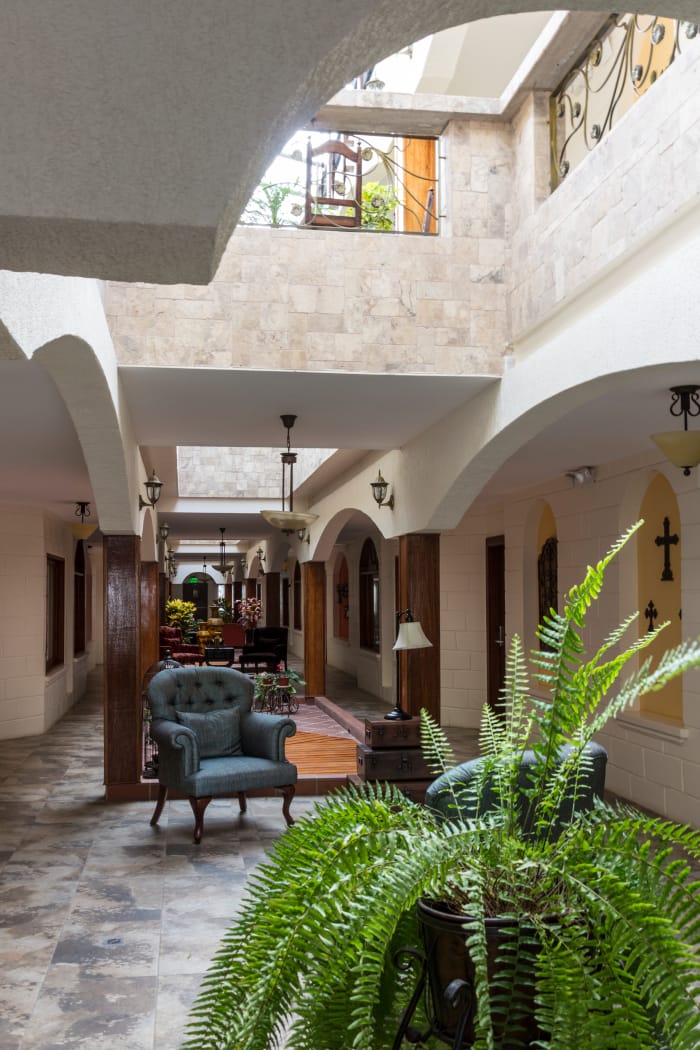 Hotel interior corridor with atrium letting in light from second floor