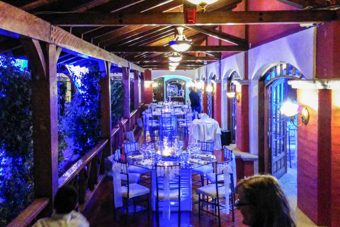 Hotel interior at night with table place settings for wedding