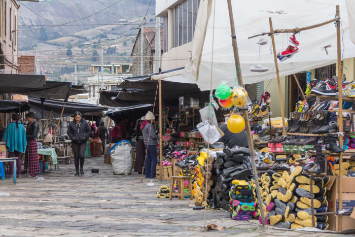 Merket vendor street stall with shoes for sale